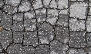 cracks on an old asphalt driveway