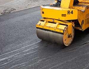 rolling and placing your newly placed driveway material