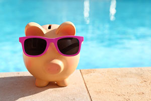 Image of piggy bank depicting cost of pool and consideration of an inground pool removal