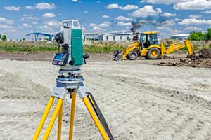 Image of surveying land during a site inspection before a fill dirt delivery