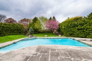 pool in backyard of a Fairfax, VA home that will be demolished by a contractor
