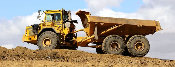 a dump truck conducting a Chantilly, VA fill dirt delivery at a construction site
