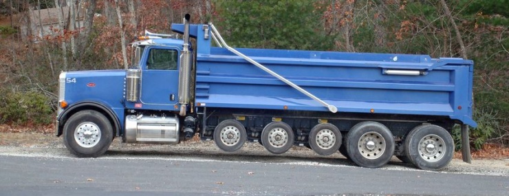 blue dump truck parked on the road after a Gainesville, VA fill dirt delivery