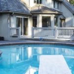 pool with a diving board in Fairfax, VA that needs inground pool removal services