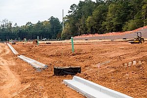 a comercial construction site where there is plenty of Maryland fill dirt spread out for land grading and filling to support a new highrise building