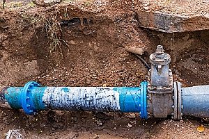 blue PVC pipe that can drain better and be better protected while buried with adequate amounts of fill dirt