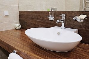 a bathroom sink that is vessel style and was introduced into a Fairax family's new bathroom during their remodeling project