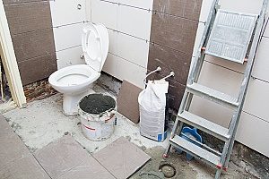 some structural weakness in the floor discovered during a Fairfax bathroom remodeling job so the homeowner must call a contractor in order to help fix the floor and finish the job