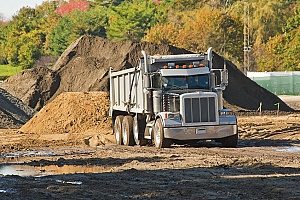 a dirt carrier that is transporting an online fill dirt order to Maryland residents who are doing a home remodeling project