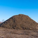 a large heap of fill dirt which will be removed from a construction site through a dirt removal contractor