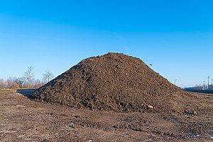 a large heap of fill dirt which will be removed from a construction site through a dirt removal contractor