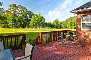a wooden deck in a homeowners backyard that was installed after having received Fairfax, VA pool removal services