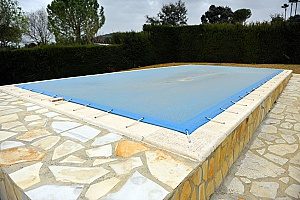 covered pool for the winter since the homeowner did not want to receive a pool removal service during the fall