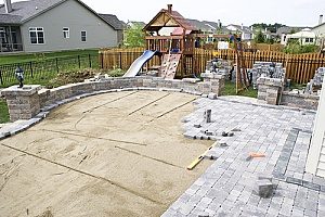backyard patio being installed over a layer of clean fill dirt for homeowners in Fairfax, VA