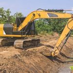 an excavator working with clean fill dirt to dig out a pipeline for a home in Fairfax, VA
