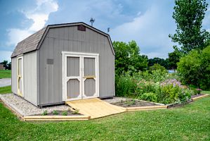 grey shed in the backyard; excellent springtime project