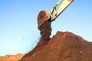 clean fill dirt being piled up at a construction site