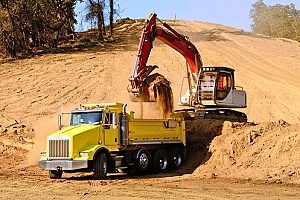 Unscreened fill dirt loaded into dump truck