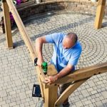 man learning how to build a gazebo