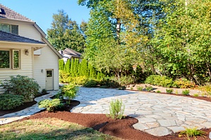 stone path with mulch surrounding in front of house