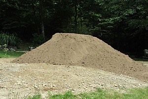 a pile of fill dirt that will be measured in cubic feet