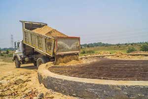 truck dumping virginia fill dirt on construction site