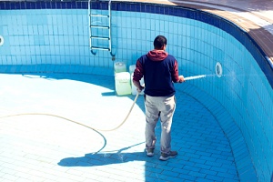a man thinking about questions to ask his pool removal contractor
