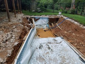 Swimming pool removal with holes