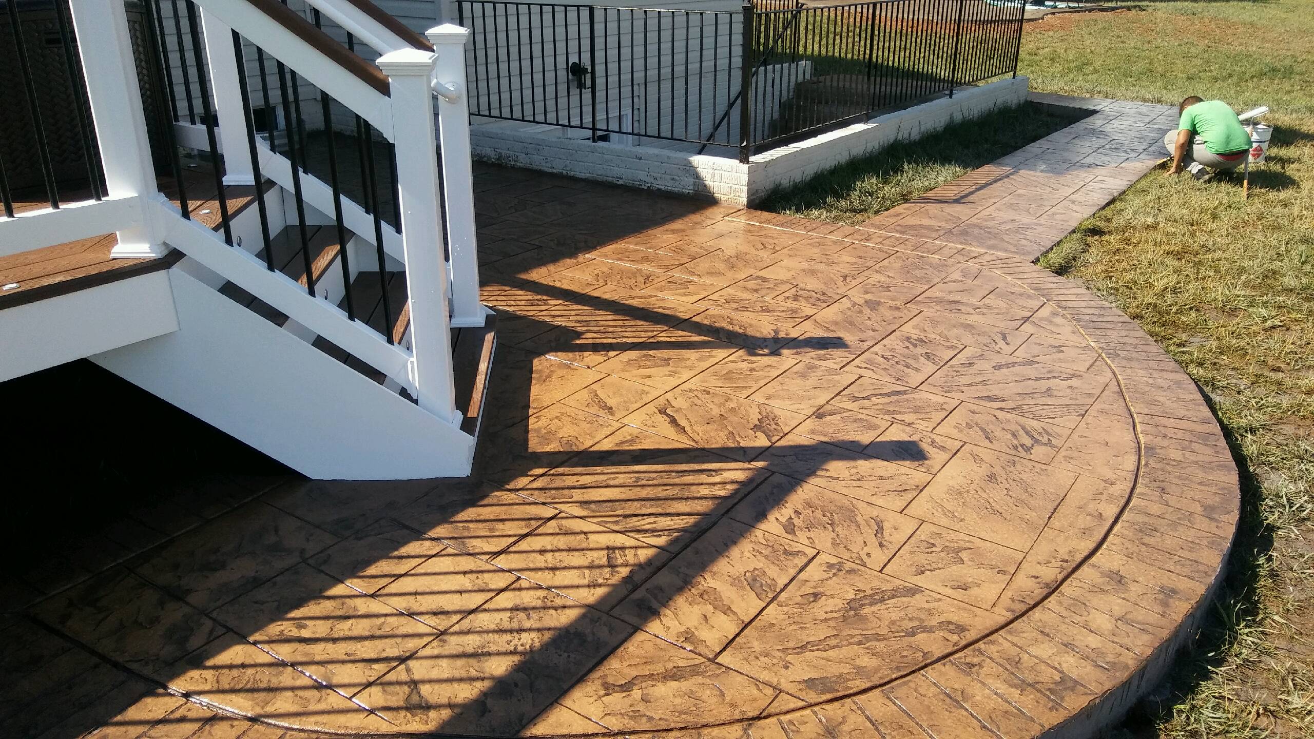 New stamped concrete patio and sidewalk