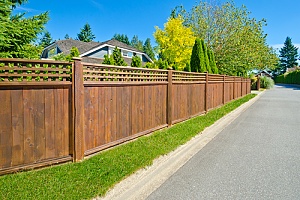 Brown privacy fence surrounding home
