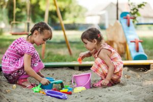 encourage children to play in a sandbox