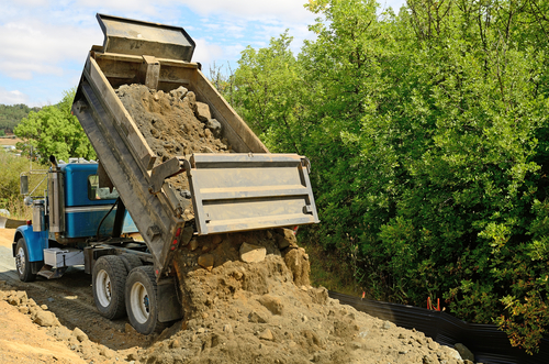 Dump truck hauling can remove dirt