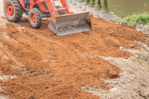 Grading and leveling land
