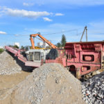 Dirt Connections mobile Stone Jaw crusher machine for crushing concrete into gravel and subsequent cement production. Salvaging and recycling of the demolition construction waste on landfill. Reuse concrete.