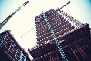 Heavy duty tower crane on building construction site. #57 stone is one of the preferred construction materials