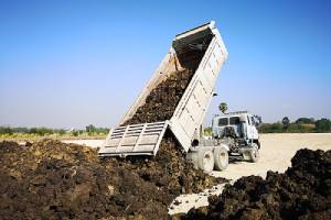 Landfill by flatbed truck. The simplest way to fill dirt disposal