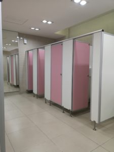 Toilet partition wall Finish with pink and grey color 