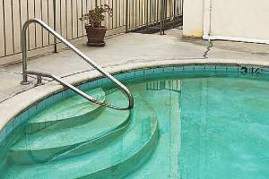 An old swimming pool. Some homeowners opt for pool removal to help their home sell