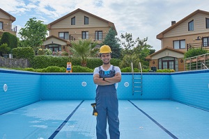 pool removal contractor repairing pool with equipment