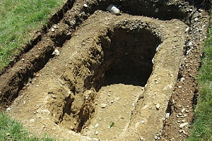 the in ground dirt hole after a hot tub was removed