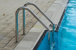 inground pool with steel stairs