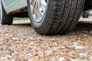car tyres on gravel driveway
