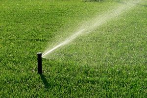 An automatic irrigation system spraying water on the lawn