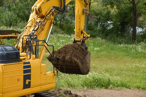 An excavator vehicle moving soil