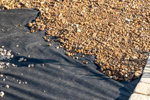 Geotextile fabric is used to keep the gravel and the soil separate