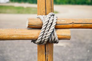 Pieces of lumber tied with one another by a rope