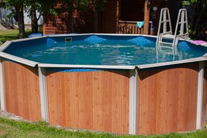 A compact pool installed on an uneven surface