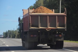 A dump truck carrying sand