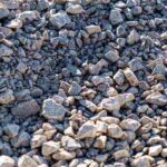 large pile of bulk #57 gravel sits ready to be used on a job site for a DIY home improvement project in Northern VA