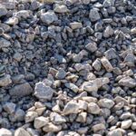 large pile of bulk 57 gravel sits ready to be used on a job site for a DIY Northern Virginia home improvement project